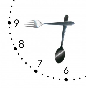 Clock made of spoon and fork, isolated on white background